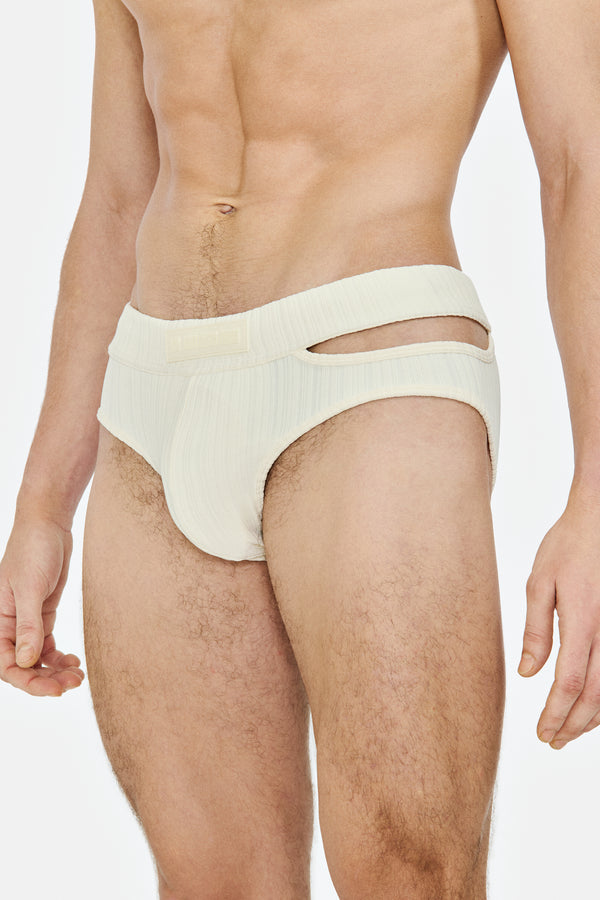 SWIM BRIEF WITH ASYMMETRICAL OPENING IN RECYCLED JERSEY