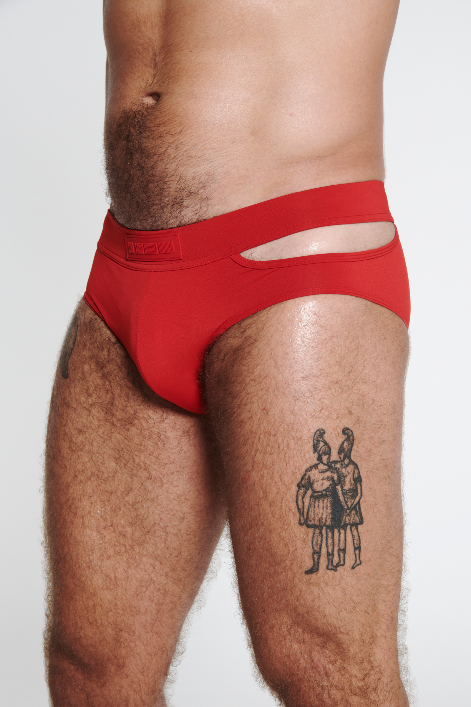 SWIM BRIEF WITH ASYMMETRICAL OPENING