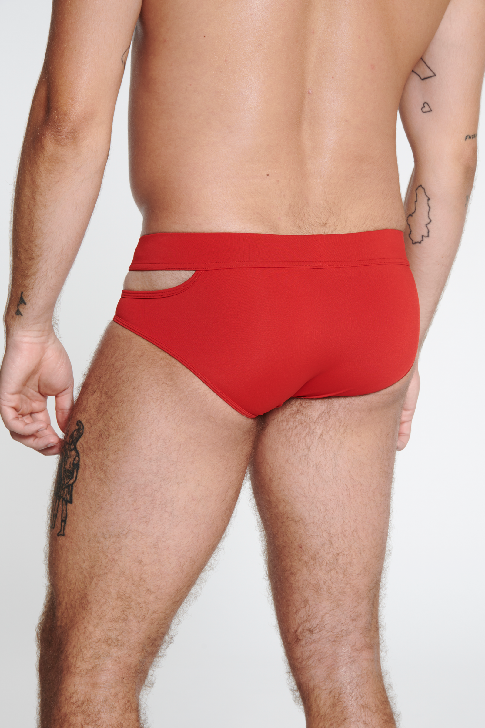 SWIM BRIEF WITH ASYMMETRICAL OPENING